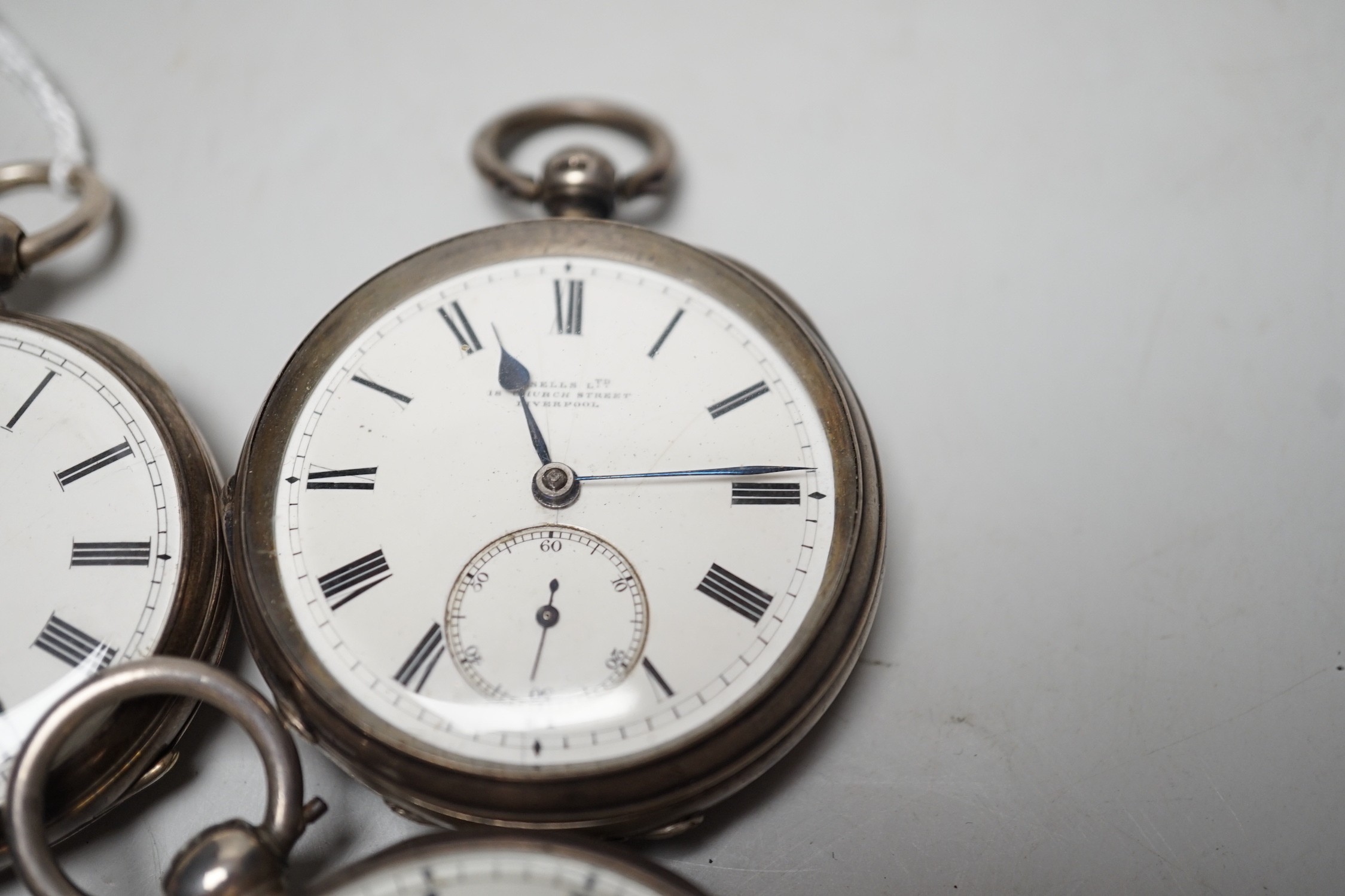 A 19th century silver pair cased keywind verge pocket watch, unsigned movement, together with three silver open faced keywind pocket watches including Fearn, Cornhill and a silver hunter pocket watch by Tanner of Lewes.